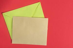Colorful envelopes and card on a vibrant background. photo