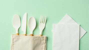 Reusable Utensils And Napkins On Green photo