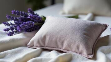 Lavender Pillow And Lavender Stems On Blanket photo