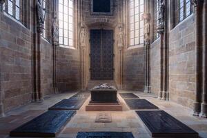 Meissen, Germany-august 17, 2022-view of ancient tombs between the tall columns and stained glass windows of Meissen Cathedral on a sunny day photo