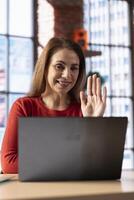 Female student trying to learn a new language from her home office, attending an online class lesson to develop her skills. Ambitious woman solving language learning exercises and tasks. photo