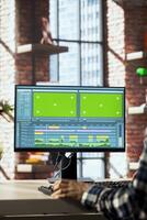 editor polishes raw footage on chroma key PC and improving audio quality. Videographer professionally adjusting clips on isolated screen computer monitor, applying sound effects to film, closeup photo