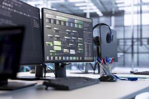 Close up of programming language on PC displays on desk in server farm used for data processing requirements of AI workloads and neural network machine learning technology photo