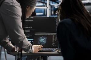Data center engineering team using AI visualization tool to optimize resource allocation. Server farm teamworking colleagues use artificial intelligence analysis software to do maintenance photo