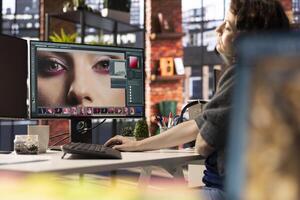 Digital media expert working on photo editing with a professional software at the creative agency, software tools. Using dual monitors to finish retouching with innovation in graphic design.