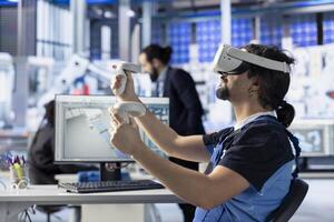 Photovoltaics factory engineer using VR goggles to analyze and modify assembly line configurations. Solar panels plant specialist using virtual reality gear to do system performance optimizations photo