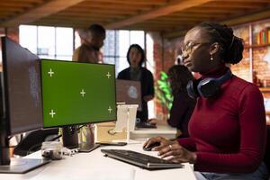 Startup developer using mockup PC, coding AI algorithm and machine learning models enhancing automation. IT professional using isolated screen computer in artificial intelligence Silicon Valley office photo