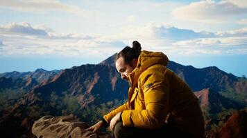 Clumsy mountain hiker dropping his phone due to lack of attention, unequipped traveler defocusing and being reckless. Modern person in the nature obsessed with technology. Camera A. photo