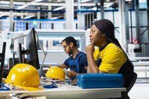 Solar panels factory engineer optimizing production flow on desktop setup, assembly line. Sustainable energy plant specialist monitoring manufacturing process, photovoltaic system. photo