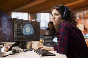 AI startup office software developer listening music, implementing algorithms enabling machine learning. Artificial intelligence tech venture IT specialist wearing headphones fixing code bugs photo