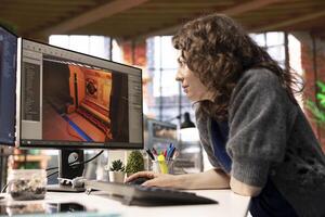 Young woman uses an AI powered assistant for game development, futuristic gaming software. Program processes commands and generates spatial designs using machine learning techniques. photo