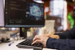 Admin typing on PC keyboard in startup office, coding advanced AI algorithm and machine learning models enhancing automation. Close up of IT professional using computer in Silicon Valley workplace photo