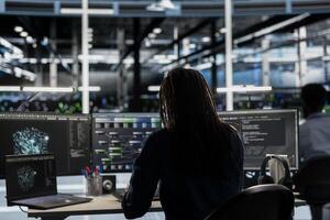 Data center computer scientist uses artificial intelligence visualization tools on device to identify errors. Server hub system administrator looks at insights to detect hardware failures photo