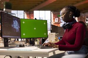 AI startup office software engineer using isolated screen PC, implementing machine learning algorithms. Woman working in artificial intelligence tech venture fixing code bugs on mockup computer photo