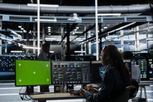 Server hub expert using AI programming language on chroma key computer to configure specialized hardware. Data center engineer using artificial intelligence neural networks on isolated screen PC photo