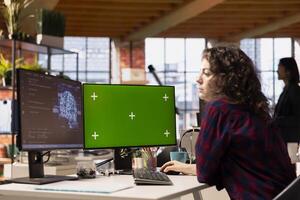 Admin using isolated screen PC working with machine learning technology in tech startup. Mockup computer display used by Silicon Valley IT specialist developing AI systems photo