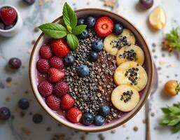 Eating Smoothie Bowl with Fresh Berries and Banana Slices photo