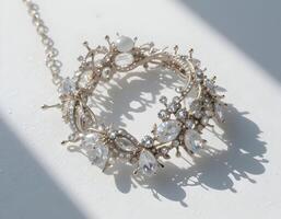 Elegant Crystal Circle Necklace with Silver Chain on White Surface photo