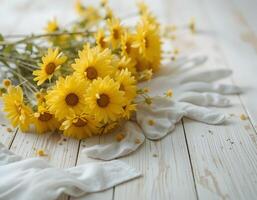Yellow Flowers and White Gloves on a Rustic Wooden Surface photo
