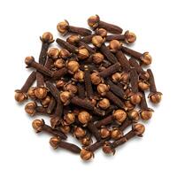 cloves are scattered on a white background photo