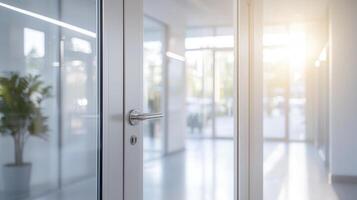 Bright sunlight streaming through open glass door, illuminating modern workspace with warm, inviting glow blurred background photo