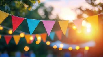 triangle Colorful pennants, string lights illuminating backyard celebration during warm golden sunset evening photo