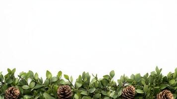 background frame made of pine branches, leaves, and pine cones over a blurred green Christmas with bokeh effect photo