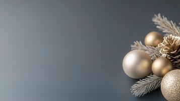 background, christmas ornaments and pine branches creating a festive border on a gray Golden perfect for holiday greetings photo