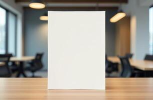 Blank document on a wooden table in a modern office with natural light streaming through large windows photo