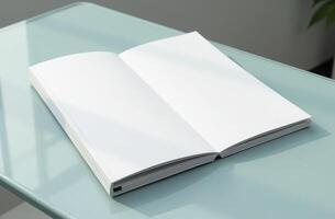 An open blank notebook resting on a glass table in a well-lit room, inviting creativity and inspiration for new ideas photo