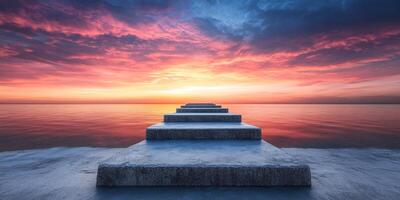 Sunset over calm waters with stepping stones leading into the horizon photo