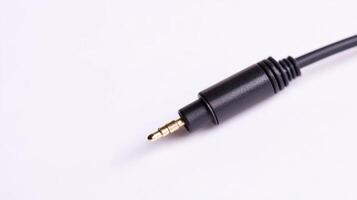 Detailed view of a black audio jack connector on a white surface for electronics enthusiasts photo