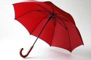 Red umbrella stands out against a plain background, showcasing elegance and practicality for rainy days photo
