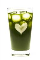 Green beverage served in a tall glass with heart-shaped ice cubes creating a refreshing drink appearance photo