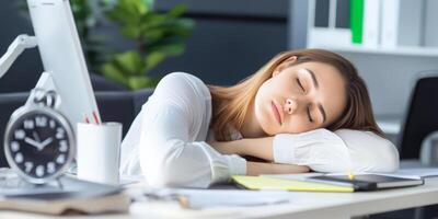 Worker takes a moment to rest while seated at a desk in a modern office during the afternoon photo