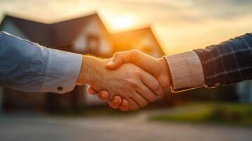 Partnership agreement at sunset between two individuals in a residential neighborhood photo