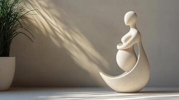 Elegant abstract sculpture of a pregnant figure with soft lighting in a modern setting photo