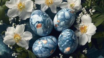 Decorative blue eggs with floral arrangement for spring celebration and festive decoration photo