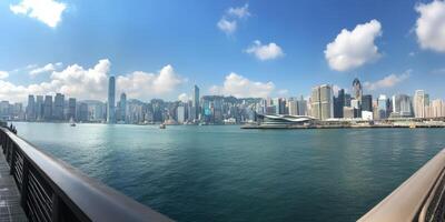 Vibrant skyline of Hong Kong with calm waters and clouds on a sunny day photo