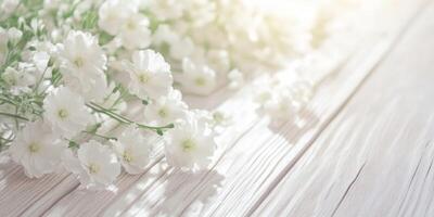 Fresh white flowers spread beautifully along a light wooden surface, creating a serene and peaceful atmosphere photo