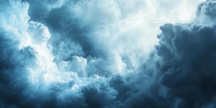 Majestic storm clouds gather in a dynamic sky above a tranquil landscape during an approaching weather front photo