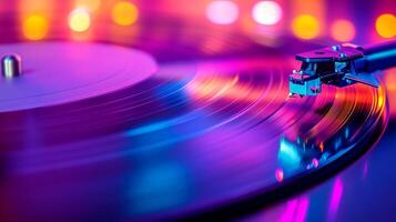 Vibrant colors illuminate a vinyl record as the turntable needle drops into groove during an evening music session photo