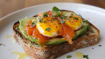Delicious toast topped with perfectly poached eggs, smoked salmon, and fresh avocado in a cozy kitchen setting photo