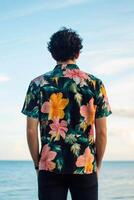 Brightly colored floral shirt captures the essence of summer by the ocean at sunset photo