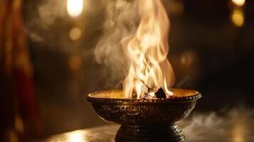 Beautiful flame dances in traditional bowl during spiritual ceremony at dusk in serene setting photo