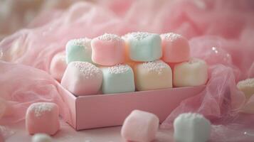 Colorful pastel marshmallows arranged elegantly in a pink box on soft fabric photo