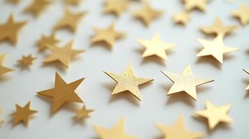 Golden star shapes scattered across a white background create a festive and celebratory atmosphere for decorations and crafts photo