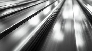 Close-up view of shiny metallic surface reflecting light with dynamic lines in an abstract composition photo