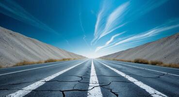 An empty road with a sky in the background photo