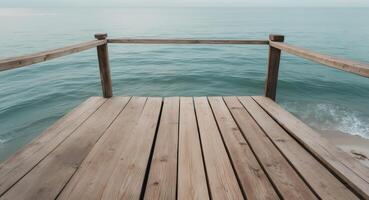 Wooden Pier Extending Over Calm Ocean Waters, A Serene Coastal Perspective photo
